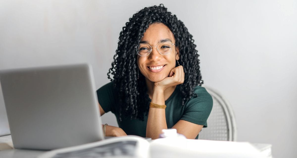 happy professional woman with laptop